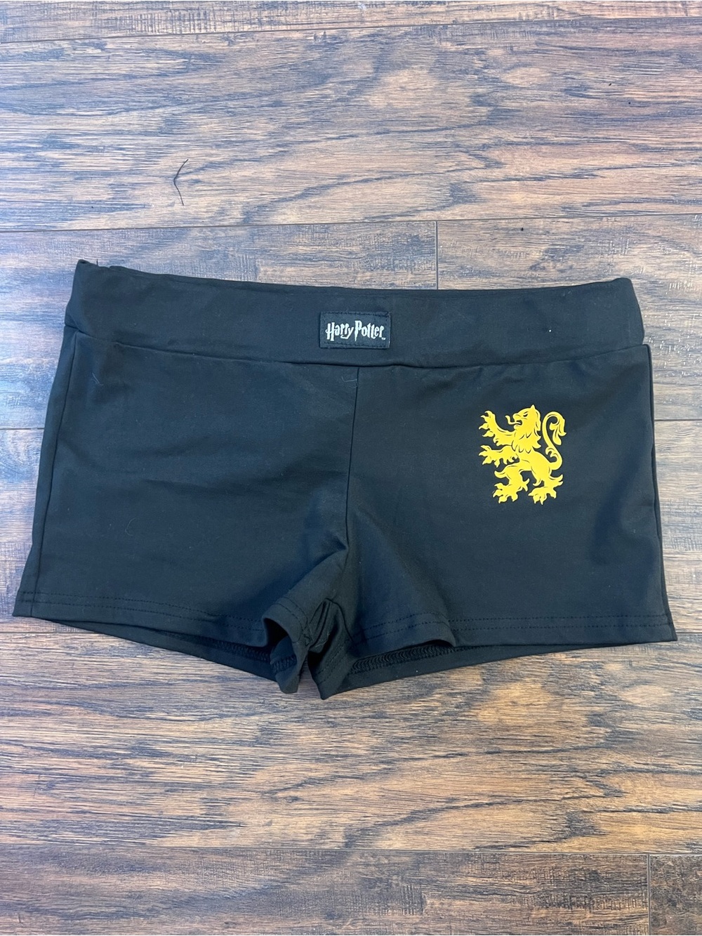 Warner Bros. Black Women's Shorts with Gold Lion Emblem
